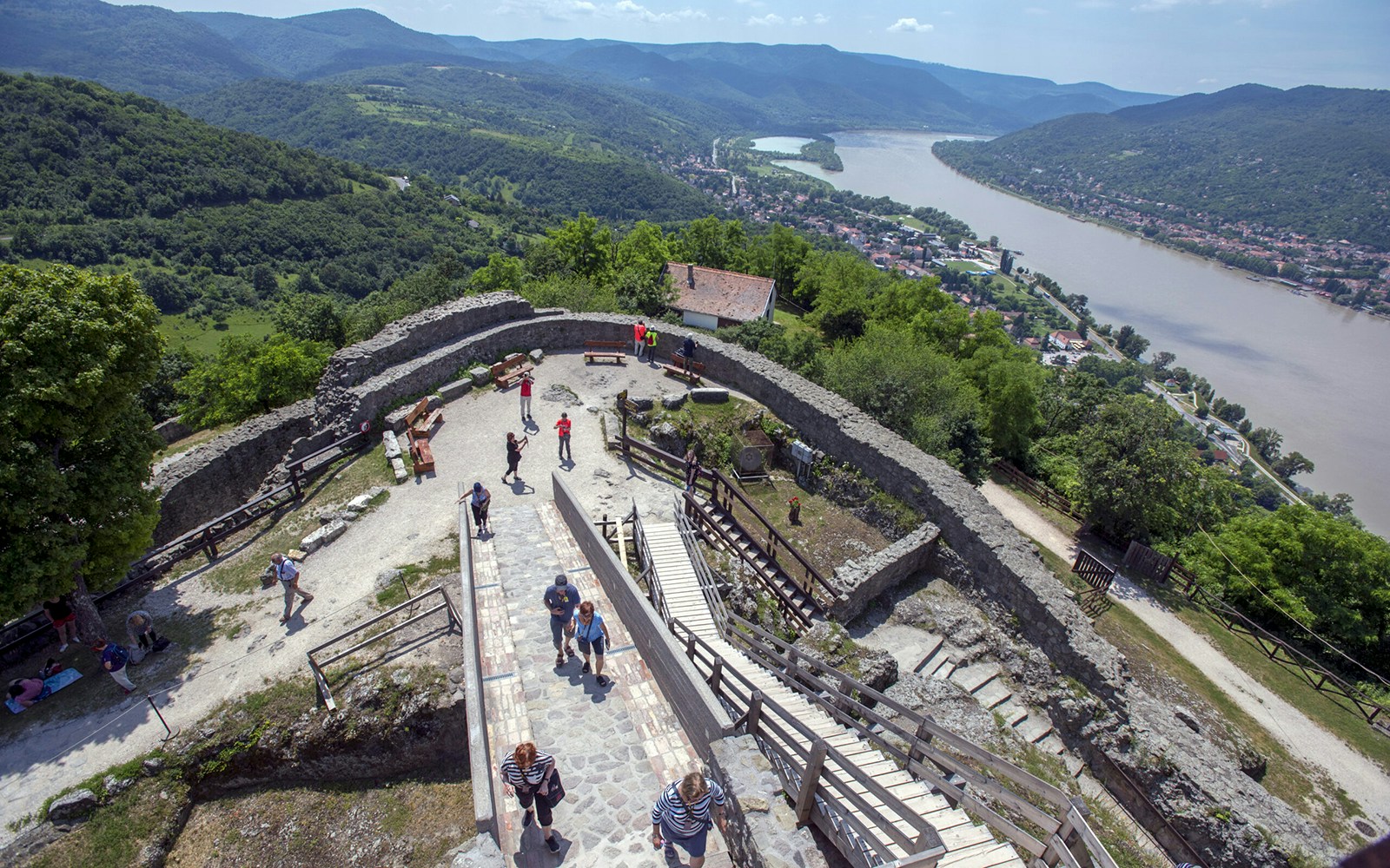 Guests exploring the panoramic view of the Danube Bend from a historic stone fortress.