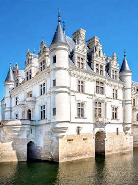 Loire Valley castle with turrets and moat, viewed on Paris to Loire Valley Castle Tours.