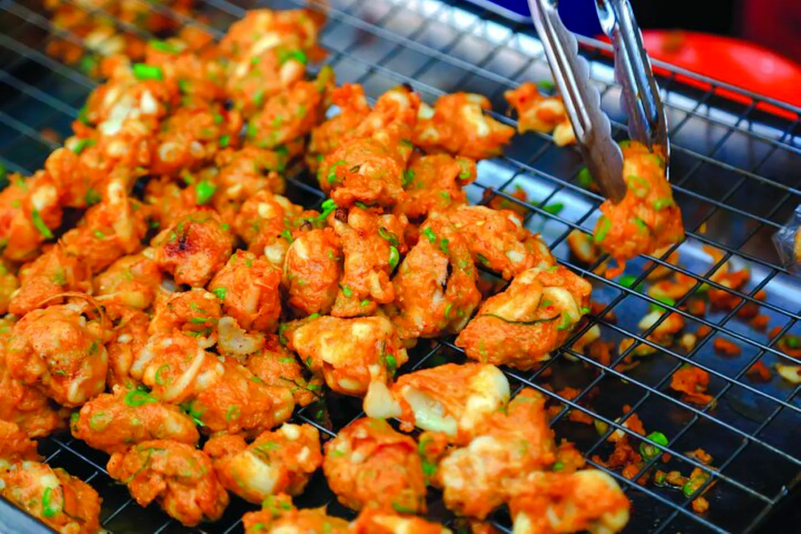 Thai street food being prepared at Amphawa Floating Markets during a private tour from Laem Chabang, Pattaya.