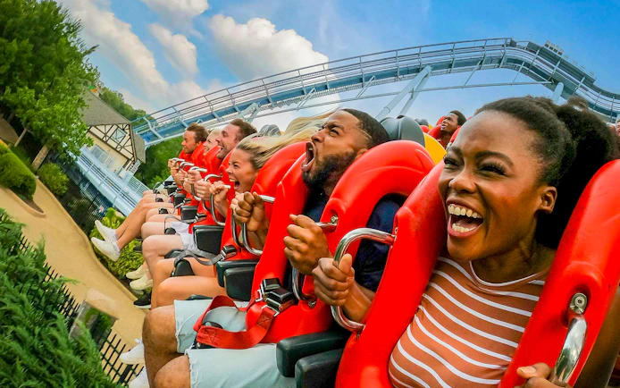 Visitors enjoying a roller coaster ride at Busch Gardens Williamsburg.