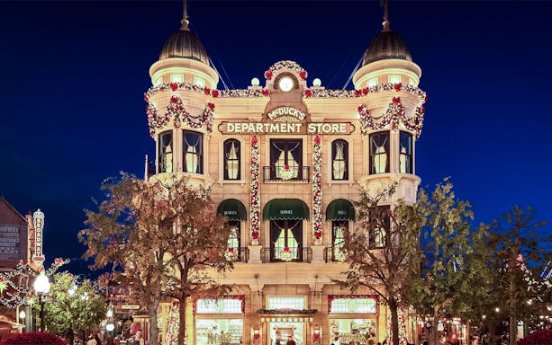 McDuck's Department Store at Tokyo Disney Resort, illuminated at night.
