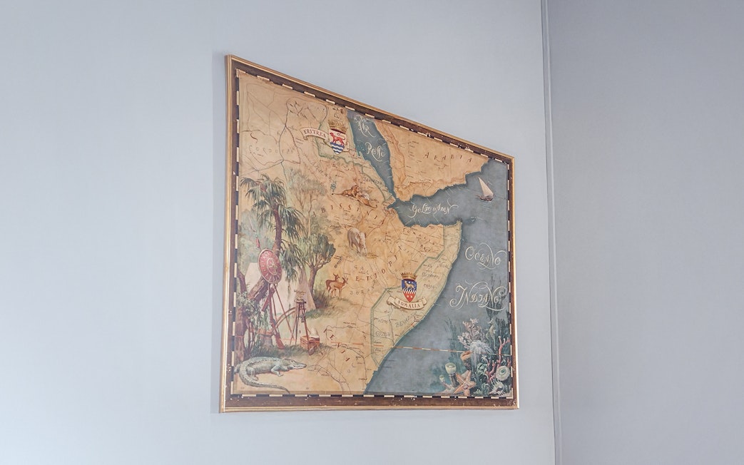 Old Ethiopian map displayed at Miramare Castle, featuring detailed illustrations and geographic labels.