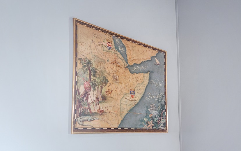 Old Ethiopian map displayed at Miramare Castle, featuring detailed illustrations and geographic labels.