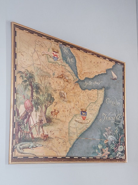 Old Ethiopian map displayed at Miramare Castle, featuring detailed illustrations and geographic labels.