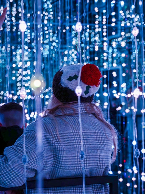Guests exploring light installations at World of Illusion, Dublin.