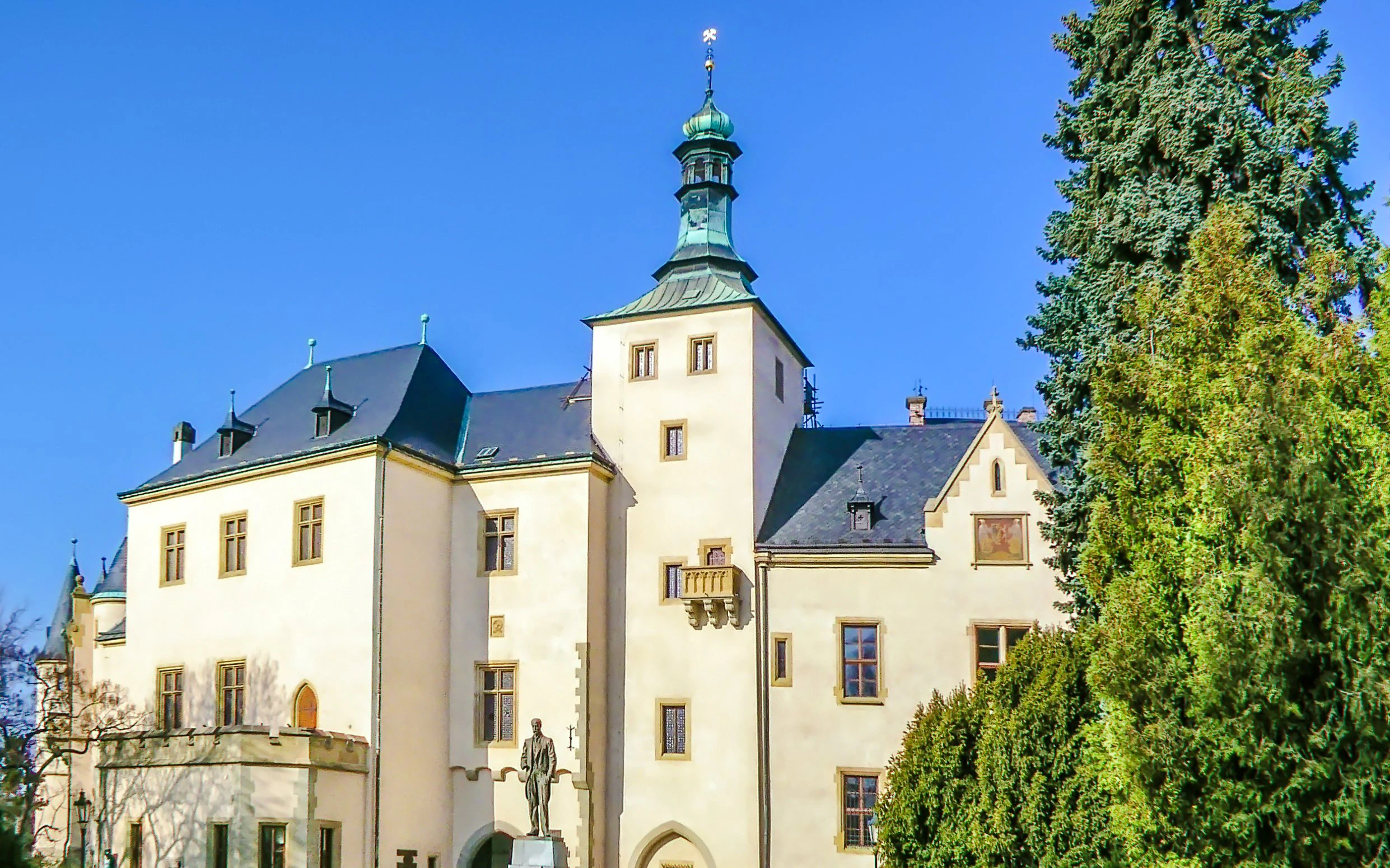 Italian Court building with tower and statue, Kutna Hora, Czech Republic.
