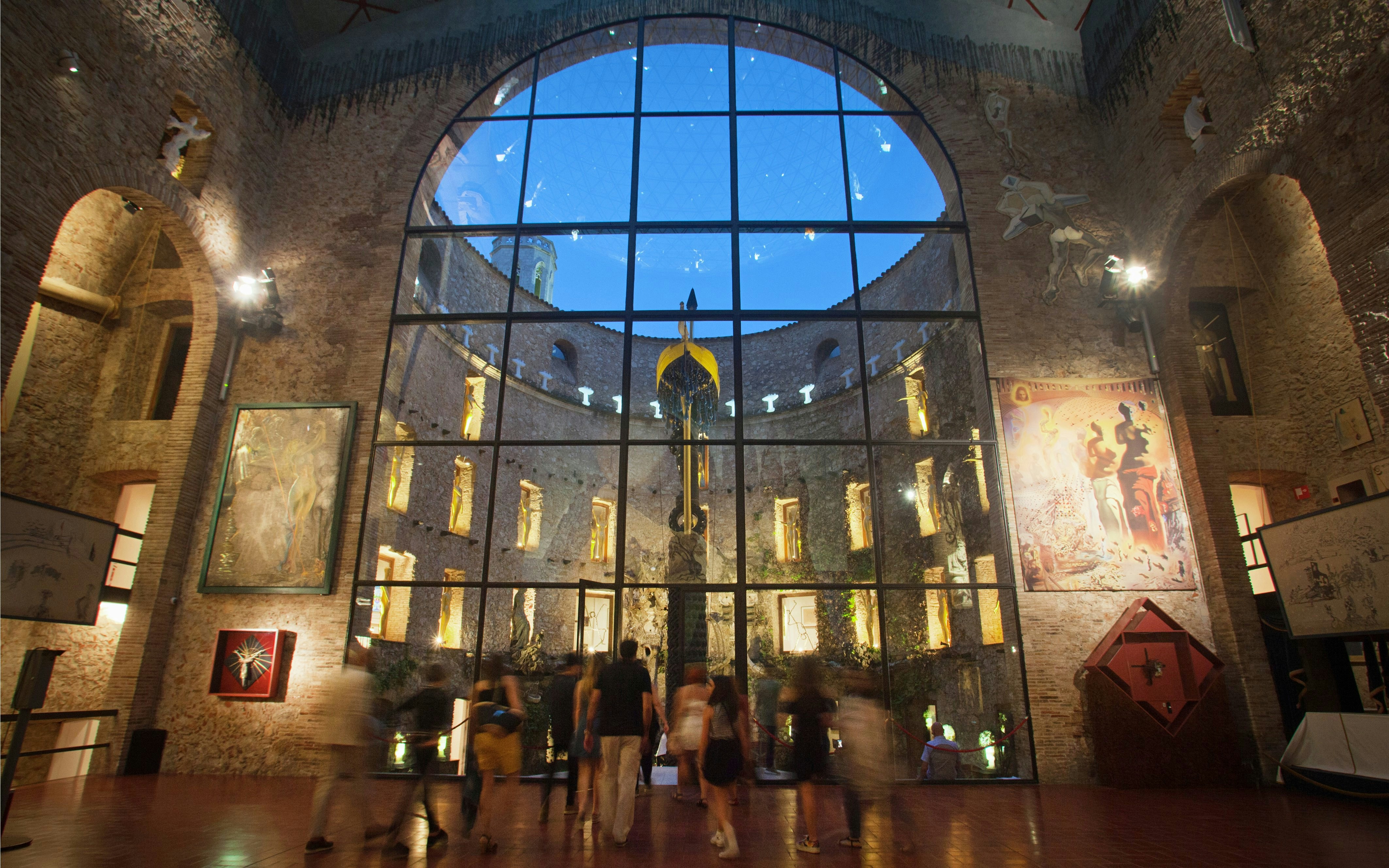 Visitors in the central courtyard and stage area of the Dalí Theatre-Museum, Figueres, Spain.