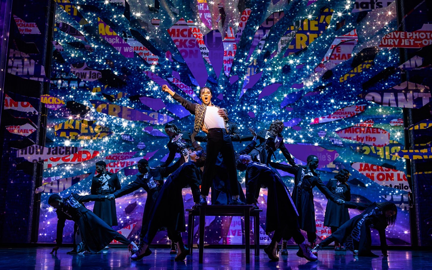 Stage performance of MJ the Musical in Brisbane with dancers and vibrant backdrop.