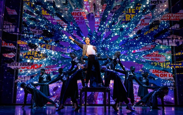 Stage performance of MJ the Musical in Brisbane with dancers and vibrant backdrop.