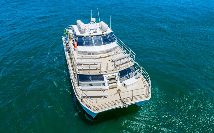 Cruise ship on Sydney Whale Watching Adventure in open ocean.