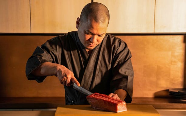 Chef preparing sushi for SUSHIROKU Omakase Course.