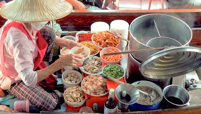 Sellers selling Thai noodles on boats, Damnoen Saduak Floating Market