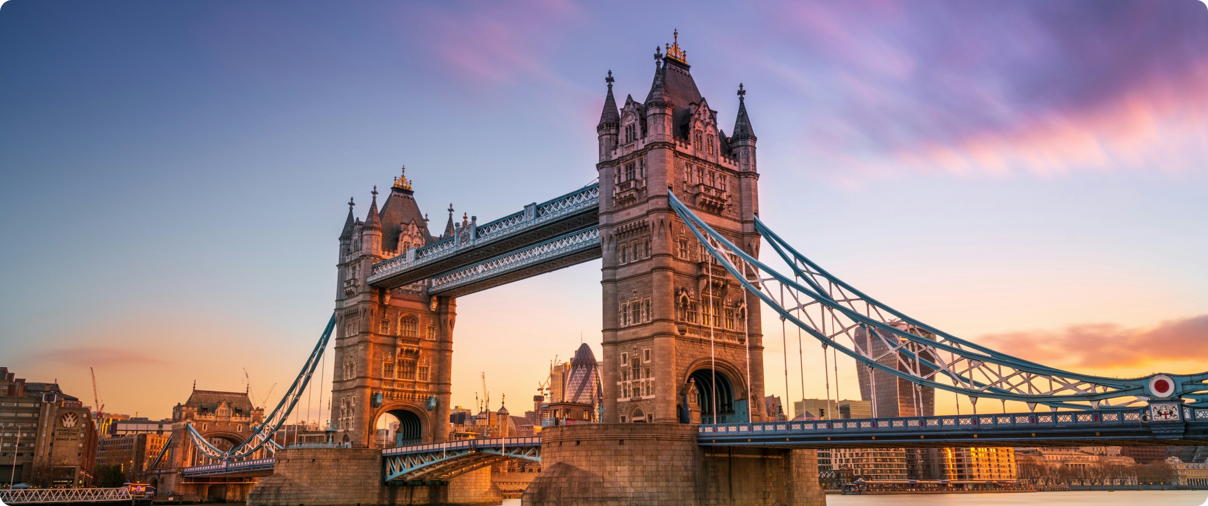 London cityscape featuring the iconic Tower Bridge over the River Thames.