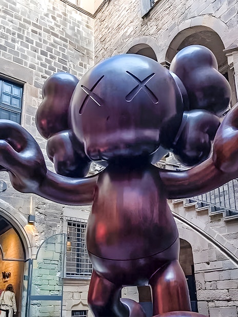Sculpture by KAWS at Moco Museum entrance in Barcelona.