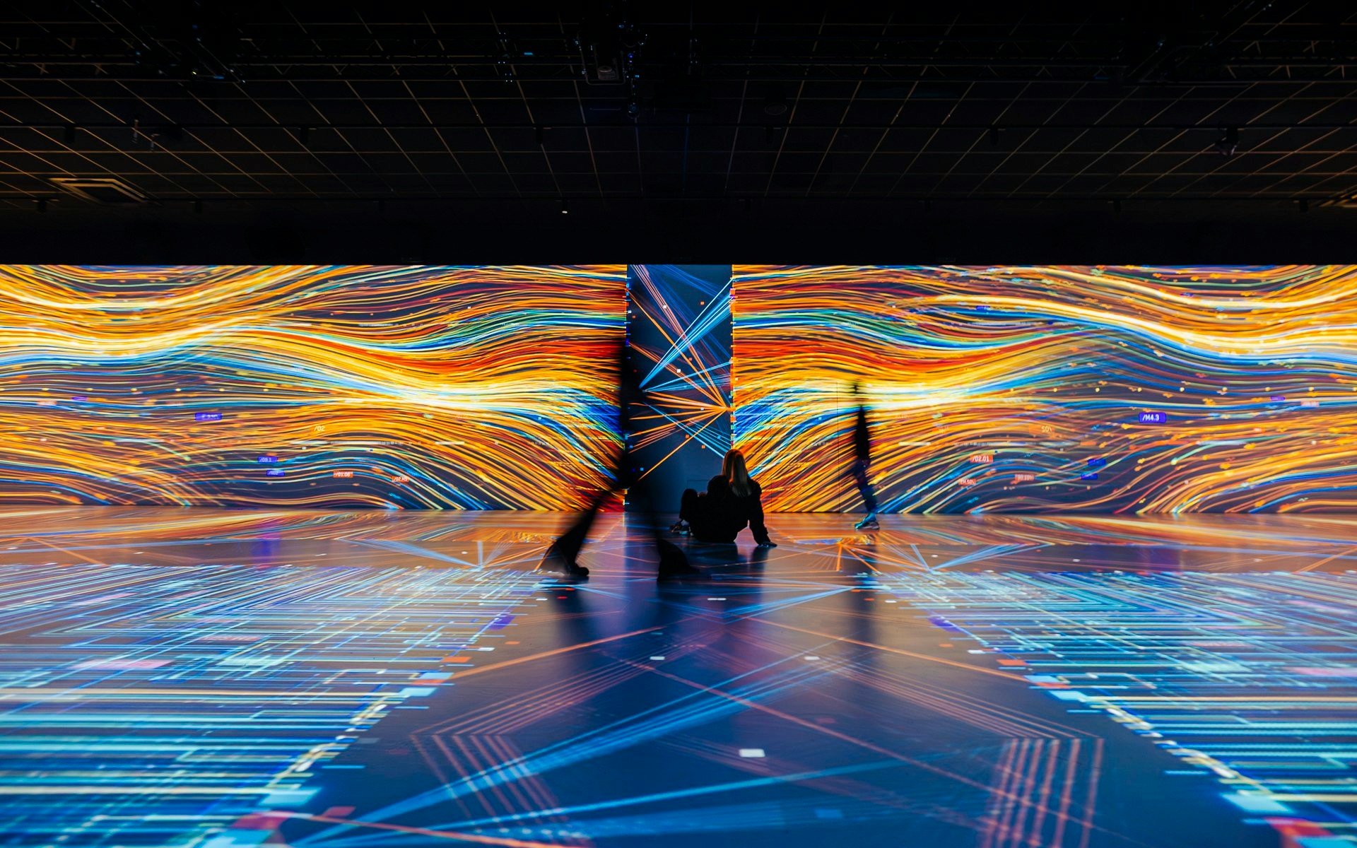 Guests viewing digital art displays at Signal Space Digital Art Gallery.