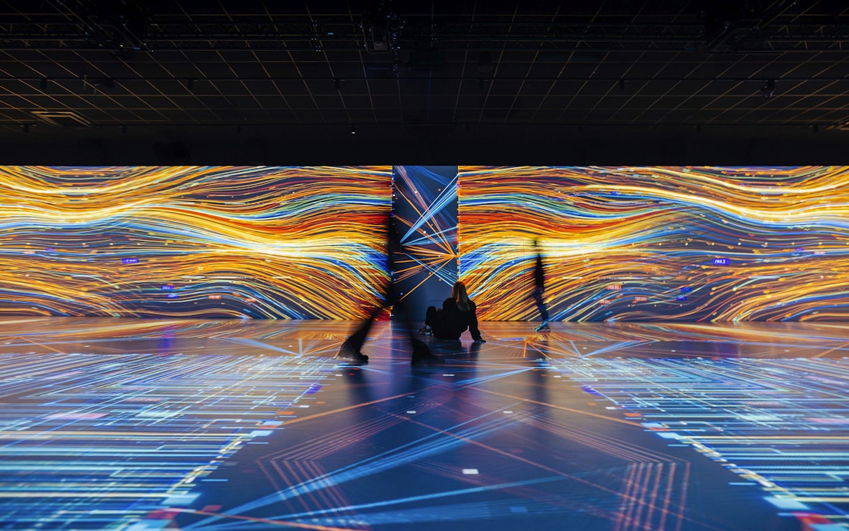 Guests viewing digital art displays at Signal Space Digital Art Gallery.