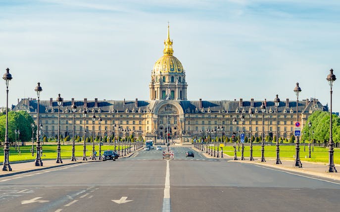 Paris street view with Les Invalides museum in the background.