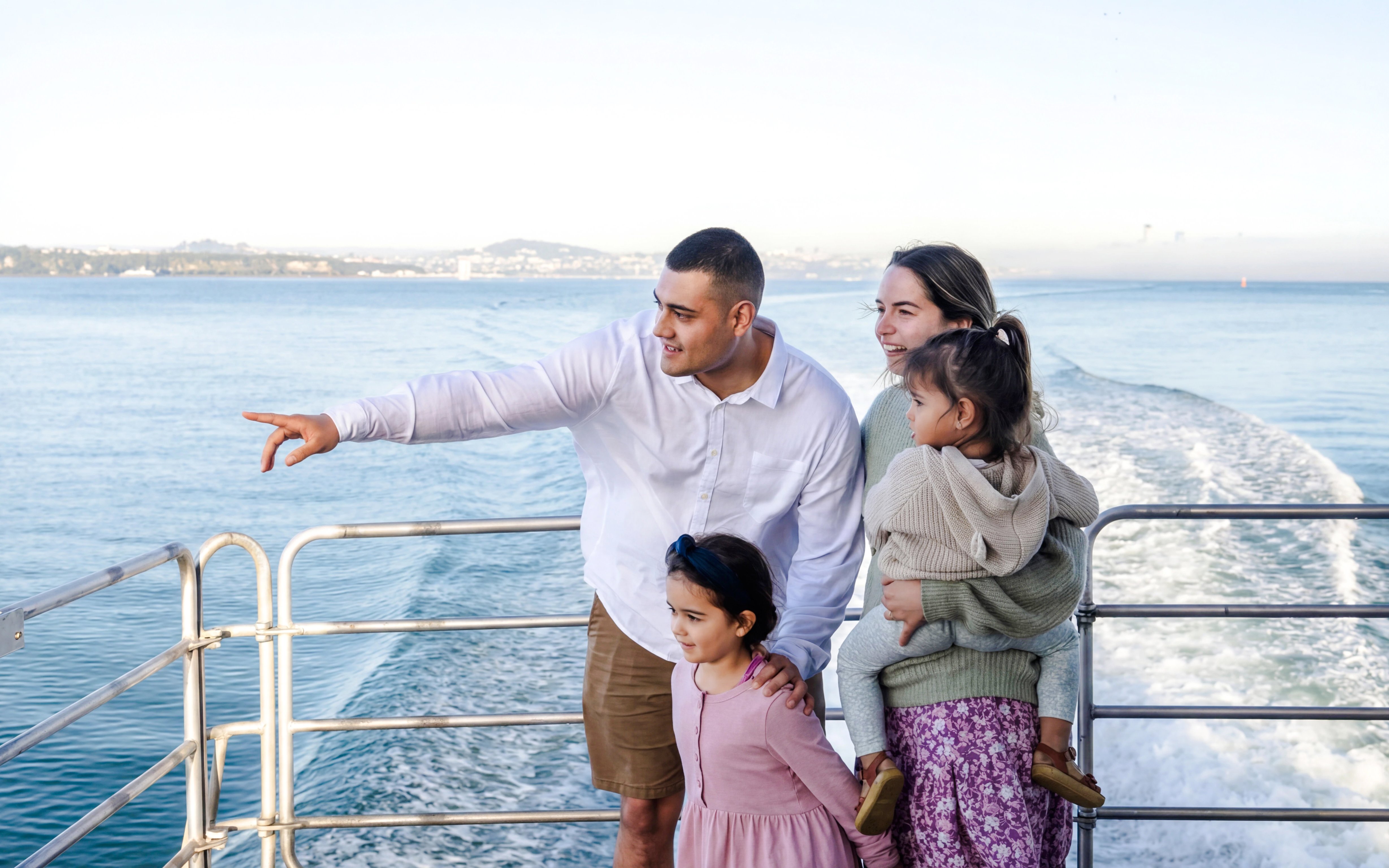 Family enjoying Auckland Harbour sightseeing cruise.