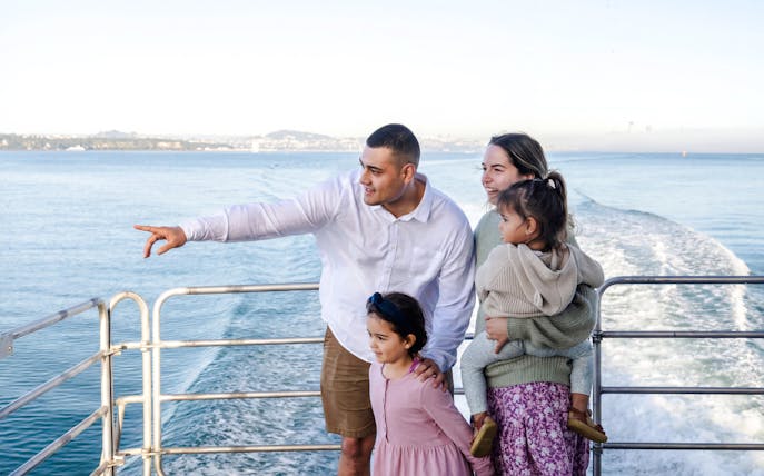 Family enjoying Auckland Harbour sightseeing cruise.