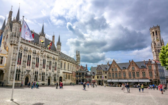 Burg Square with Town Hall, Basilica of the Holy Blood, and Belfort Tower in Bruges, Belgium.
