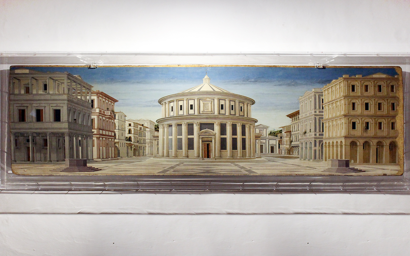 Renaissance painting of an ideal cityscape displayed at Galleria Nazionale delle Marche, Urbino.