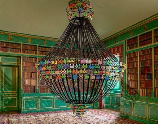 Liria Palace exterior with visitors using audio guides in Madrid, Spain.