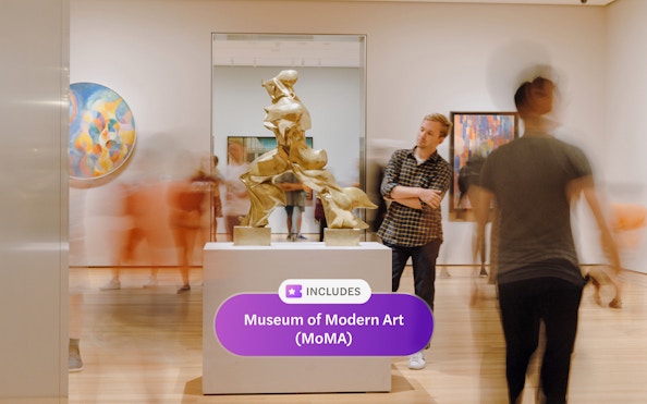 Sculpture display at Museum of Modern Art, New York, with visitors observing.