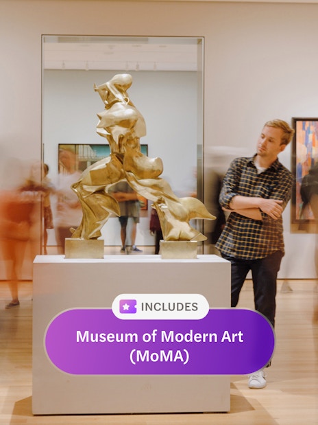 Sculpture display at Museum of Modern Art, New York, with visitors observing.