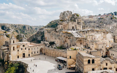 Matera's ancient stone buildings and rock church on a guided tour.