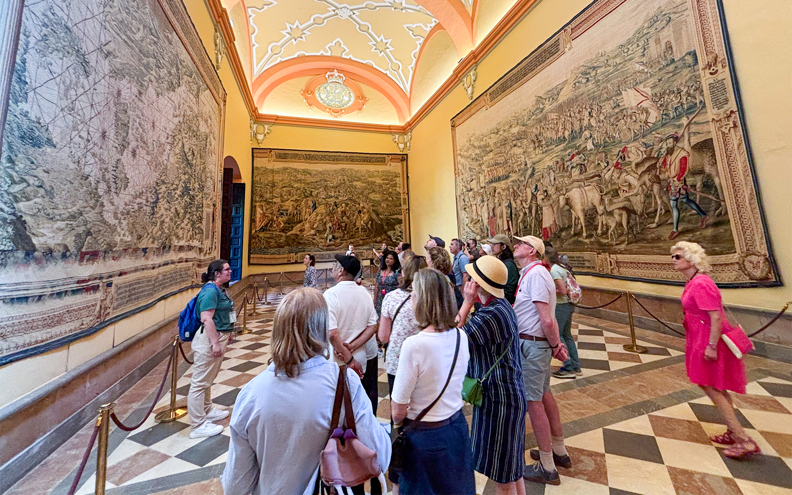 Seville Cathedral interior with guided tour group exploring historic architecture.