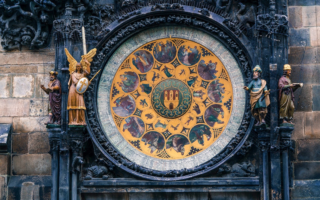 Prague Astronomical Clock with detailed zodiac signs and statues.