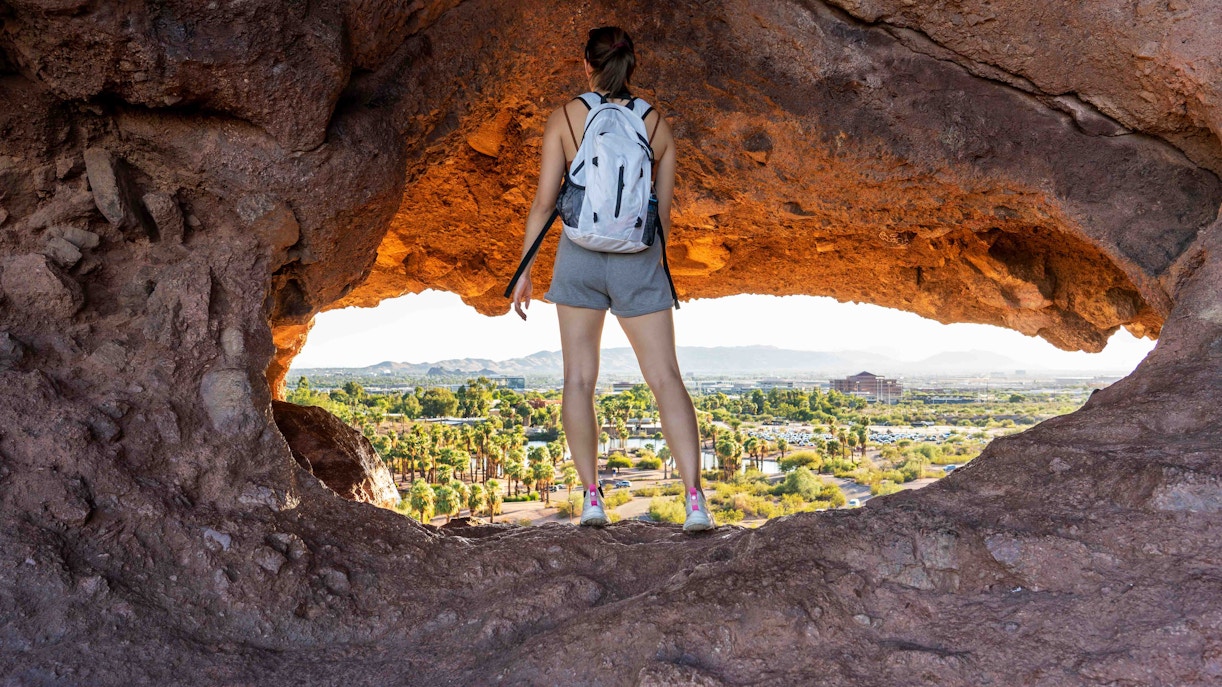 Climbers scaling rock formations at Red Rock Canyon, Nevada.