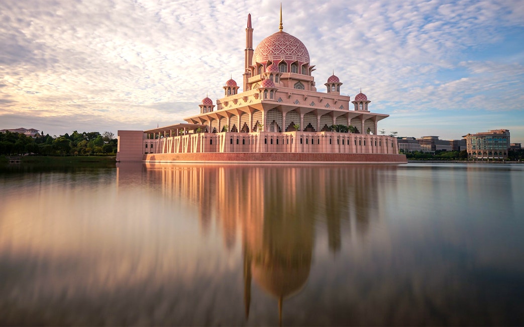 Putra Mosque reflecting in the lake at sunset, Kuala Lumpur.