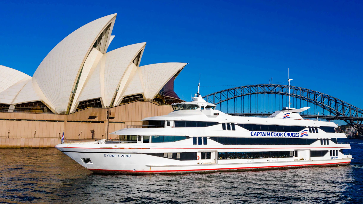 Sydney Opera House and Harbour Bridge with Captain Cook cruise ship.