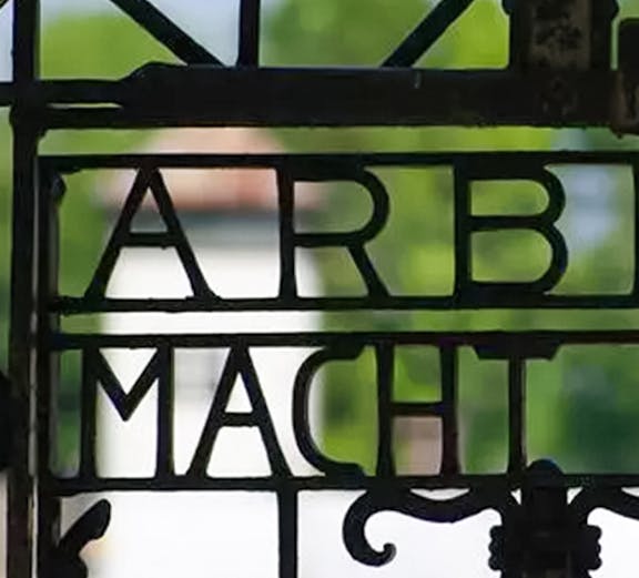 Entrance gate with "Arbeit Macht Frei" at Dachau Concentration Camp, Germany.