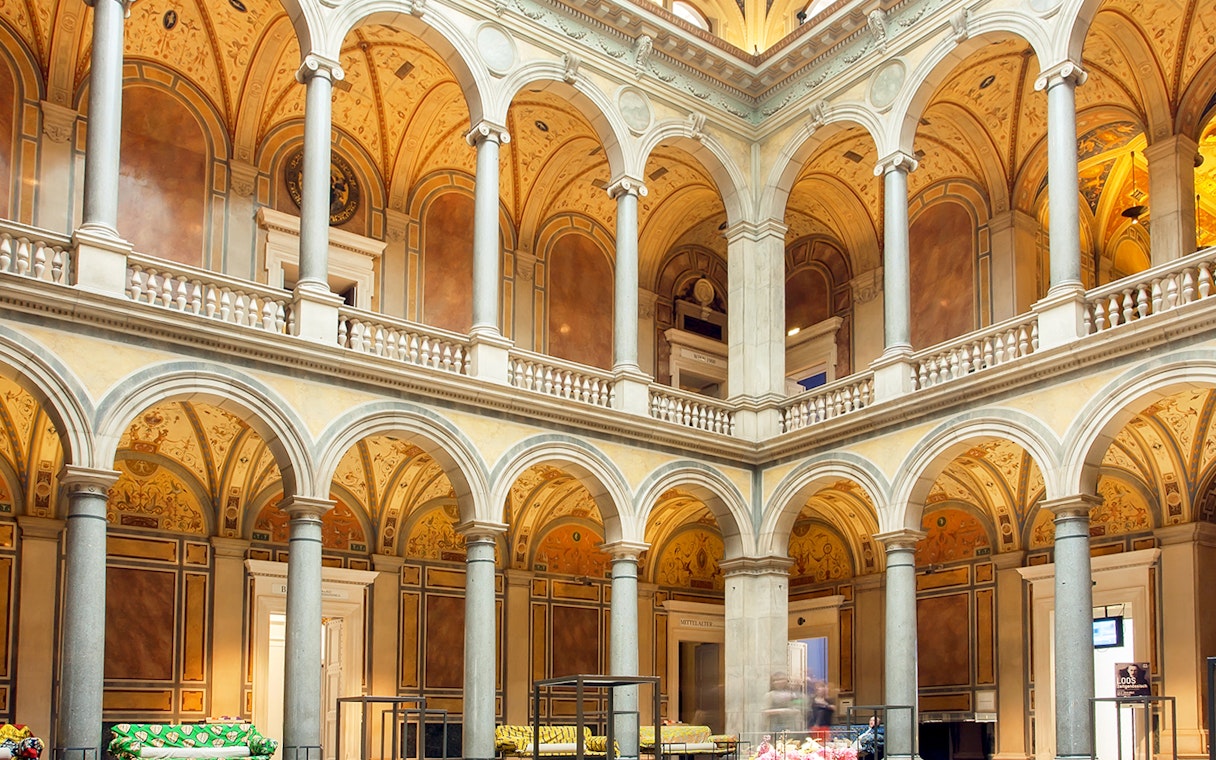 Interior of MAK Museum of Applied Arts in Vienna with ornate arches and columns.