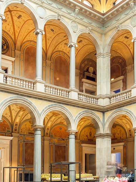Interior of MAK Museum of Applied Arts in Vienna with ornate arches and columns.