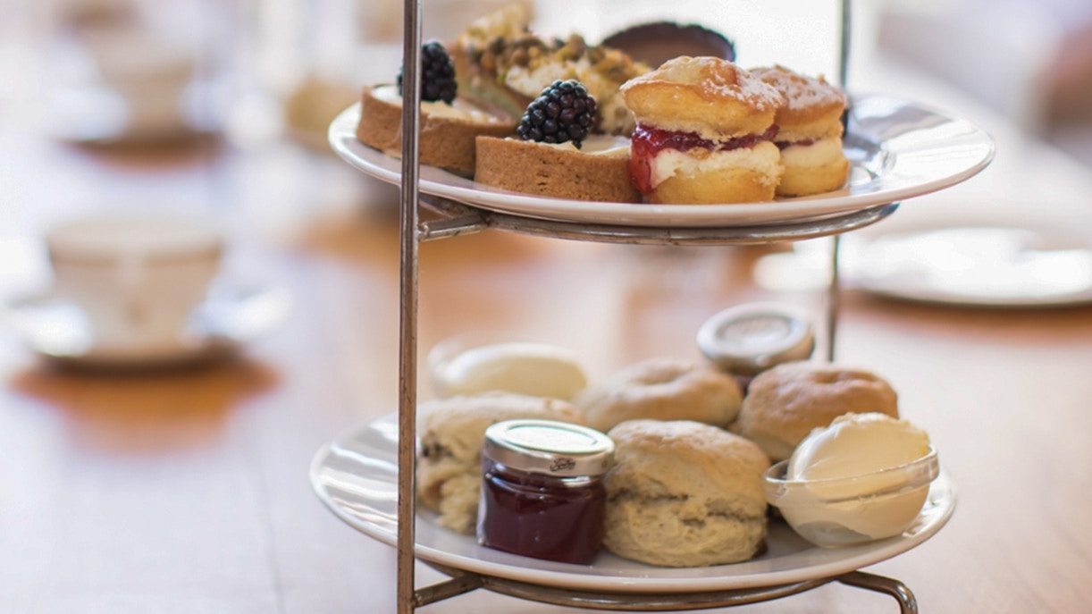 Afternoon tea with scones and pastries at Westminster Abbey tour.