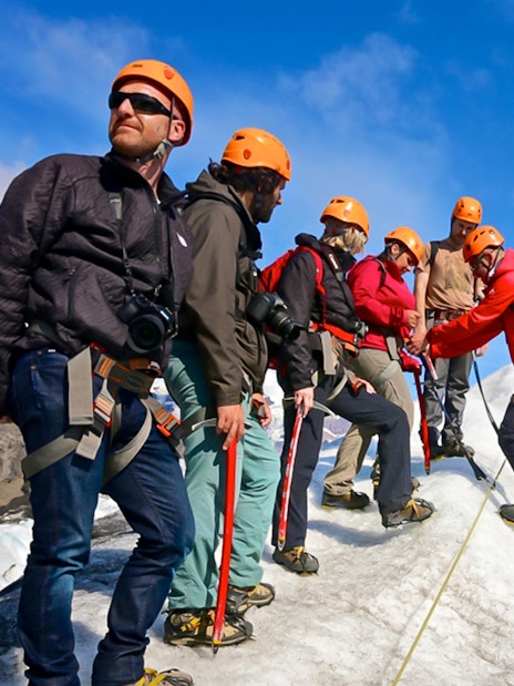 Guests hiking and ice climbing on a glacier in Skaftafell, Iceland.