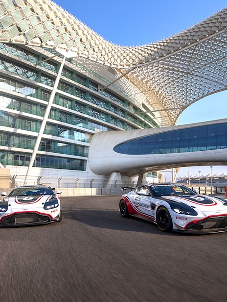 Aston Martin GT4 cars on track at Yas Marina Circuit, Abu Dhabi.