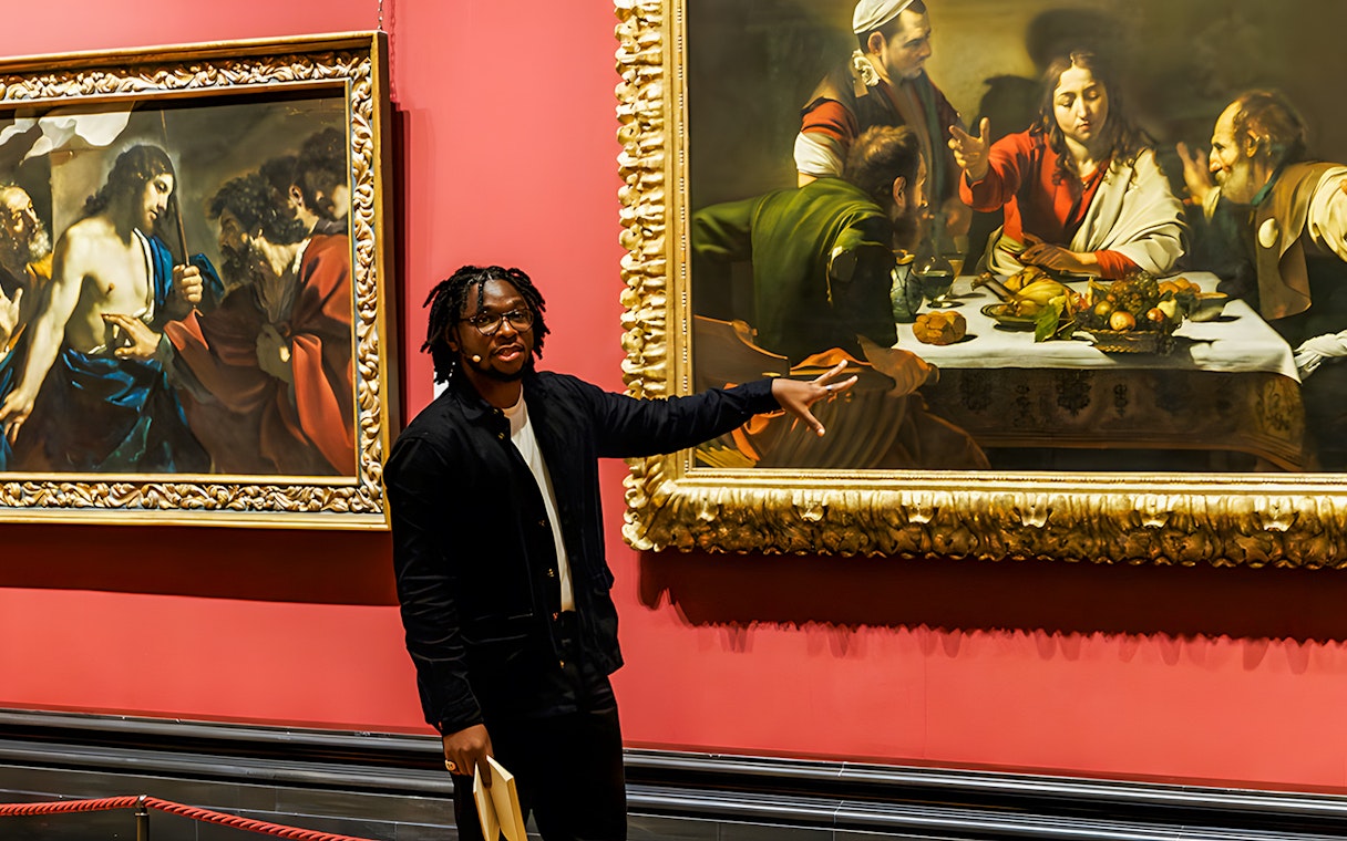 Tour guide explaining paintings at the National Gallery London.