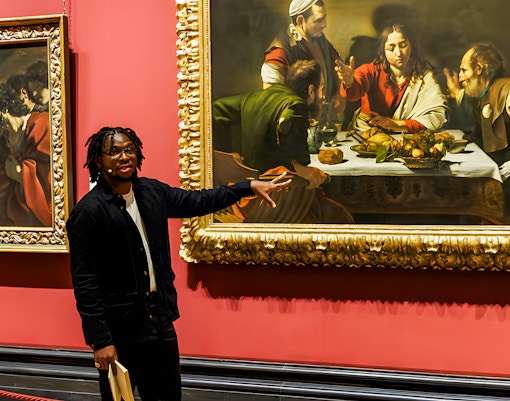 Tour guide explaining paintings at the National Gallery London.