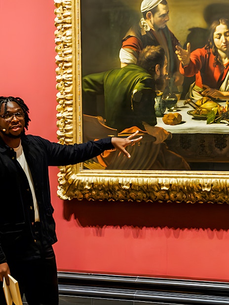 Tour guide explaining paintings at the National Gallery London.