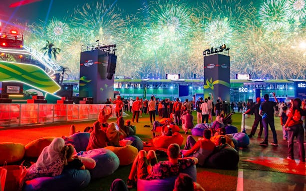 Crowd watching fireworks at Formula 1 Jeddah Grand Prix 2026 event.