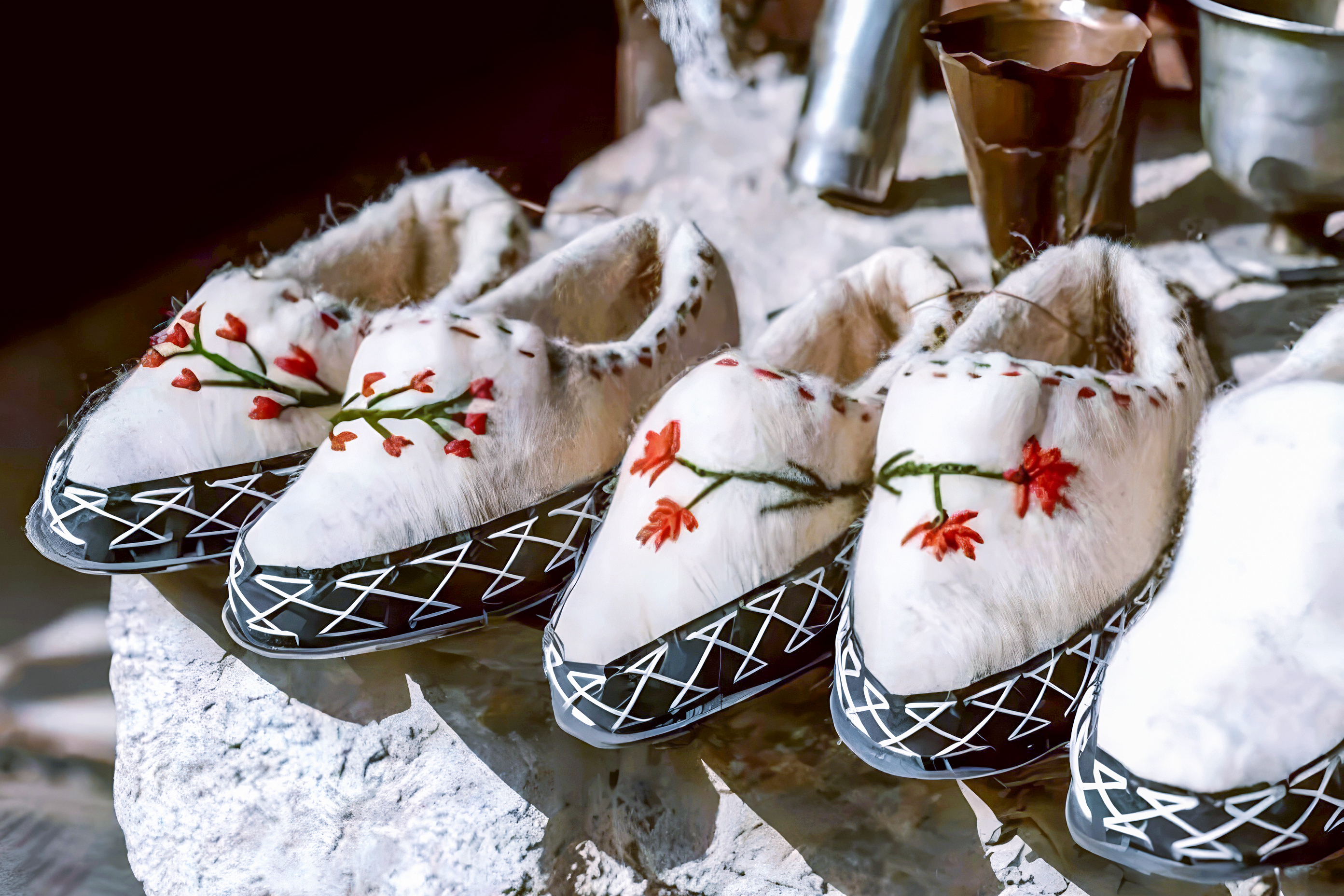 Traditional Albanian slippers with floral embroidery at Ethnographic Museum, Kruja Castle, Albania.