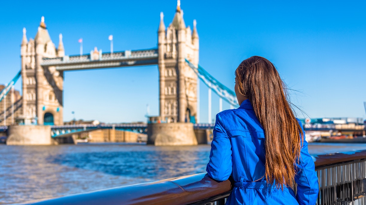 Woman overlooking Tower Bridge in London.