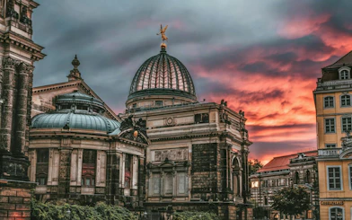 Dresden Academy of Fine Arts dome at sunset, part of the self-guided city exploration game.