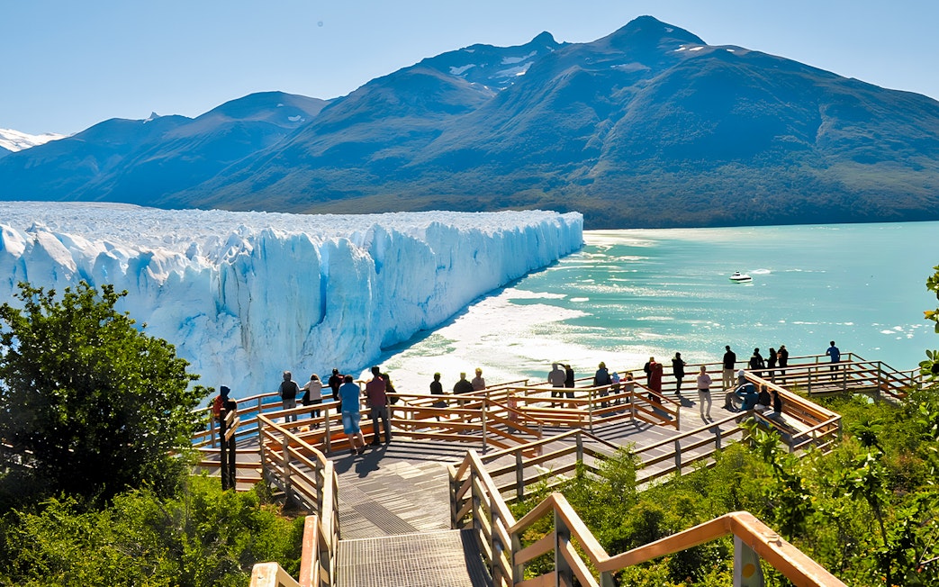 Visitors on a viewing platform overlooking Perito Moreno Glacier in Argentina.