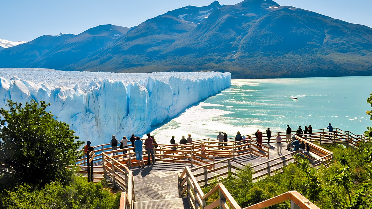 Visitors on a viewing platform overlooking Perito Moreno Glacier in Argentina.