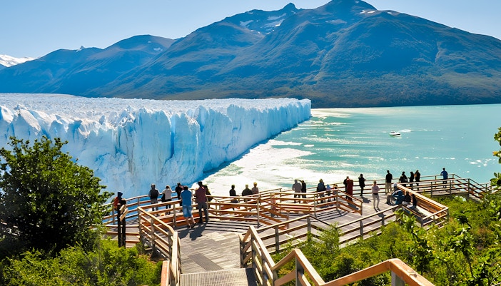 Visitors on a viewing platform overlooking Perito Moreno Glacier in Argentina.